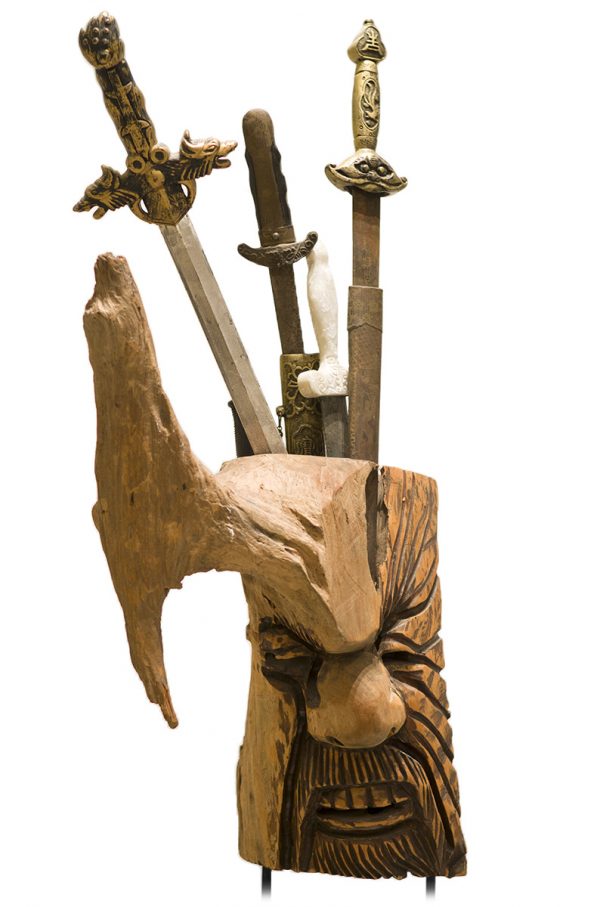 Wooden Head Sculpture with Swords